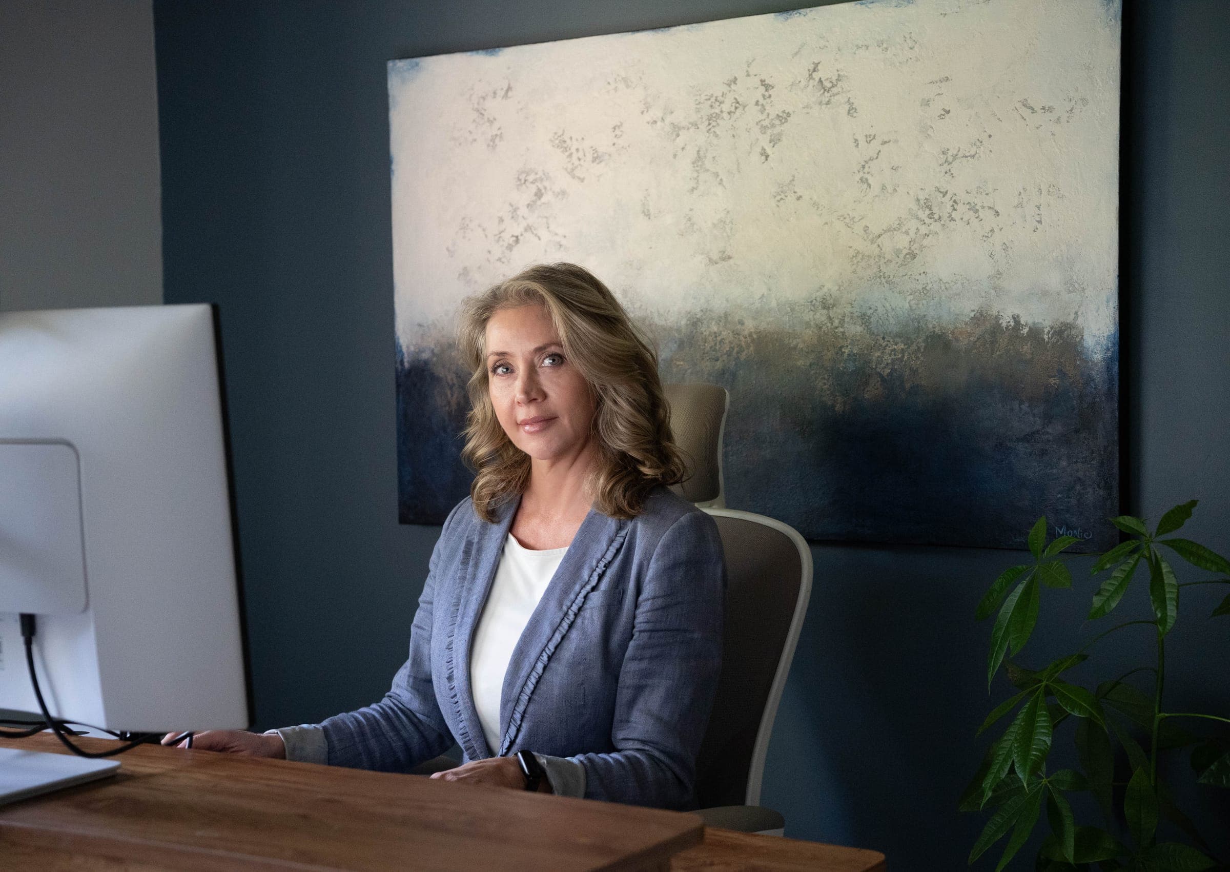 Aimee Van Pelt at her desk